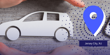 Paper-cut white car between hands with a blue map pin pointing to Jersey City, New Jersey (NJ).
